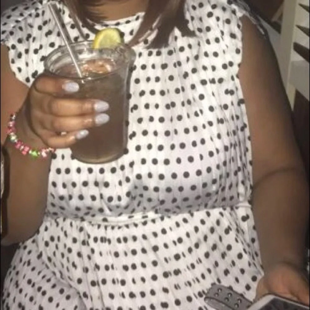 Pleated sleeveless swing dress - Picture 2 of 3